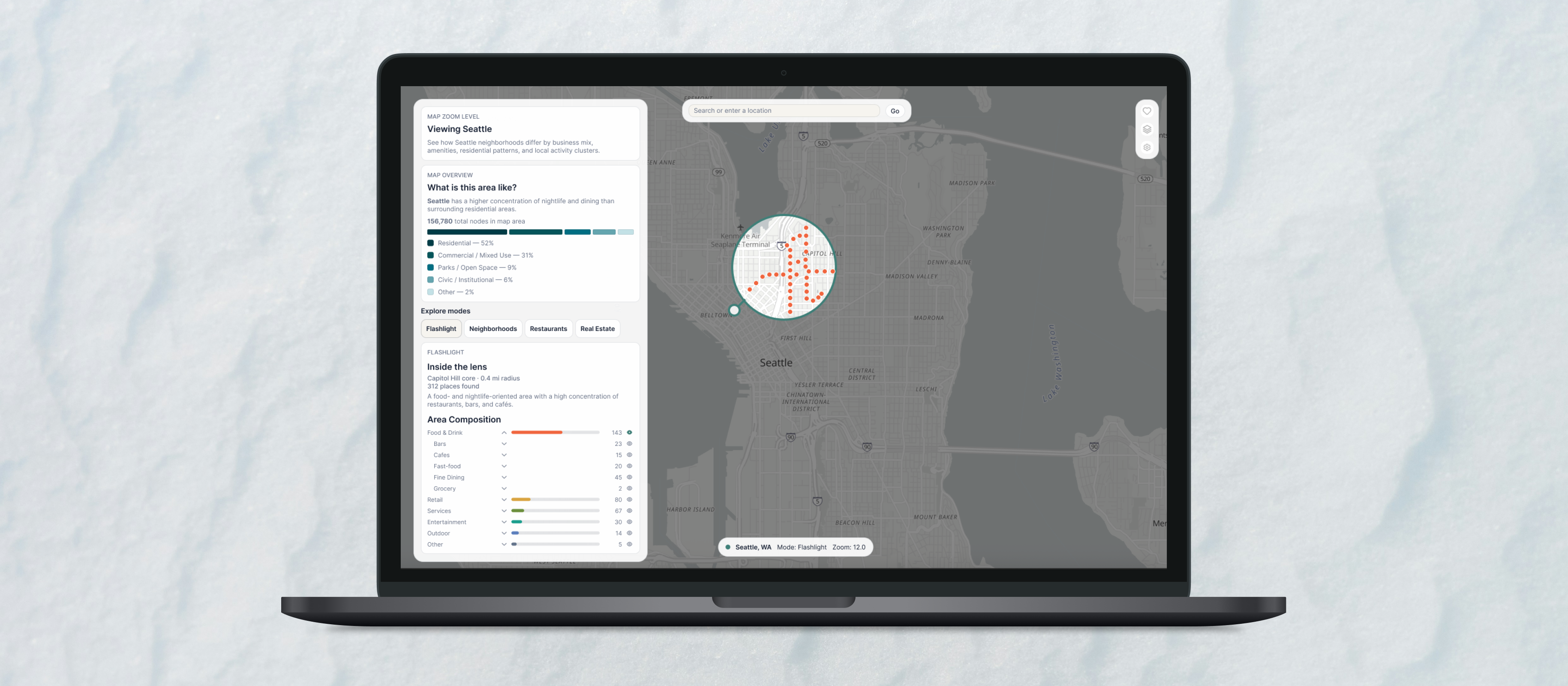 Laptop mockup of the map exploration product showing Seattle with a flashlight lens over Capitol Hill and a context panel summarizing the area